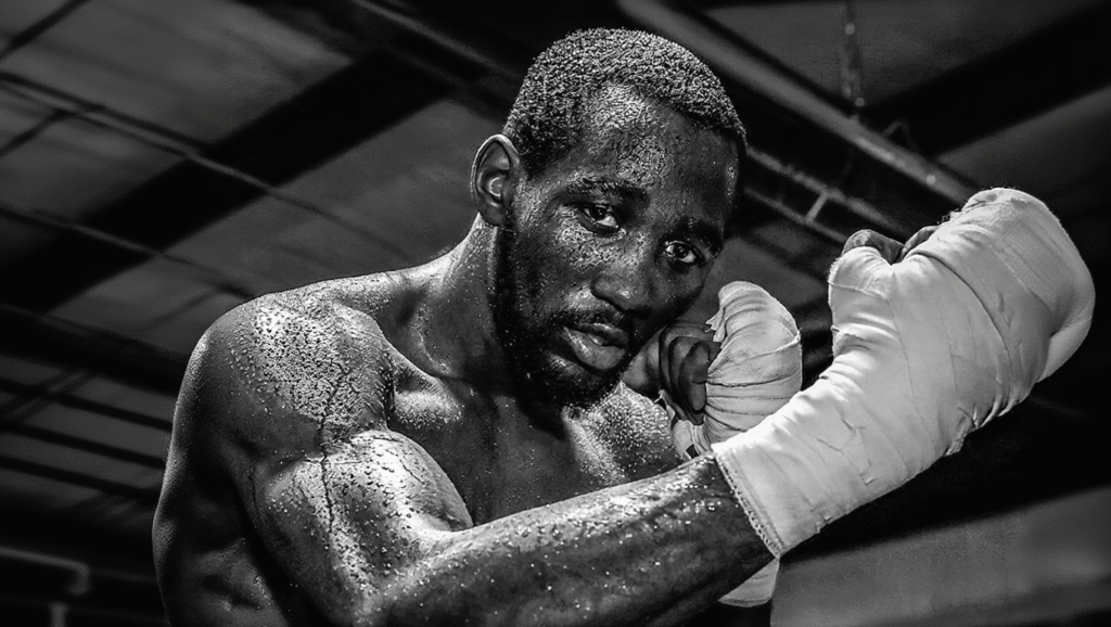 Ritratto in bianco e nero Terence Crawford campione pound-for-pound, fasciature mani, sguardo intenso pugile imbattuto in palestra